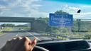 The Welcome to Pennsylvania sign can be seen over a car dashboard