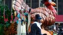 Parade participants wave from a turkey-shaped float at the 98th Annual 6ABC Dunkin' Donuts Thanksgiving Day Parade.