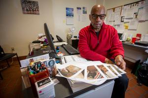 Fred Way is executive director of the Pennsylvania Alliance of Recovery Residences, which voluntarily certifies recovery houses. Here, he shows photographs of residences in the process of being inspected.