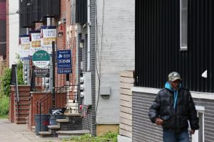 Property management signs advertise student housing for rent on Willington Street near West Oxford Street, a neighborhood adjacent to Temple University, in North Philadelphia on Tuesday, May 14, 2019. Development has introduced multi-unit luxury student housing to blocks formerly lined with rowhomes.